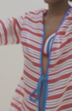 video of red and white striped caftan with blue hems