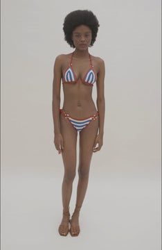 video of Blue and white crochet triangle bikini with red trim