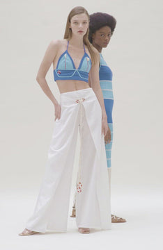 video of white wide leg sailor pants with red and white lifesaver detail