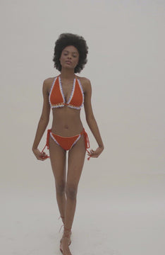 video of crochet red bikini with white ruffle trim